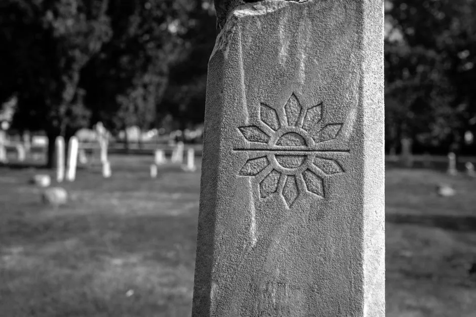 A weathered historic headstone in an old cemetery, illustrative of the sites this archive documents